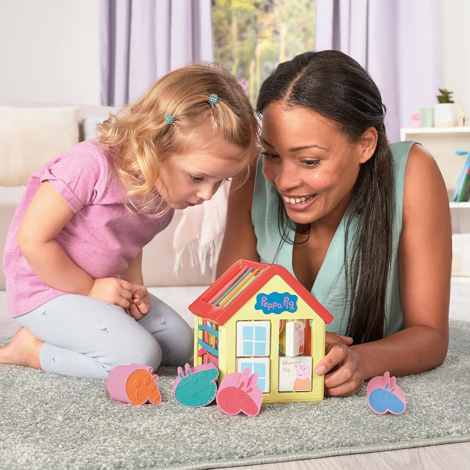 image:imageTOMY Toomies Grow with Peppa Pig  Peppas Activity House  Kids Activity Center with Sensory Shape Sorting and Color Matching Games  Includes 4 Peppa Pig Family Textured Blocks  18 Months and UpPeppas Activity House
