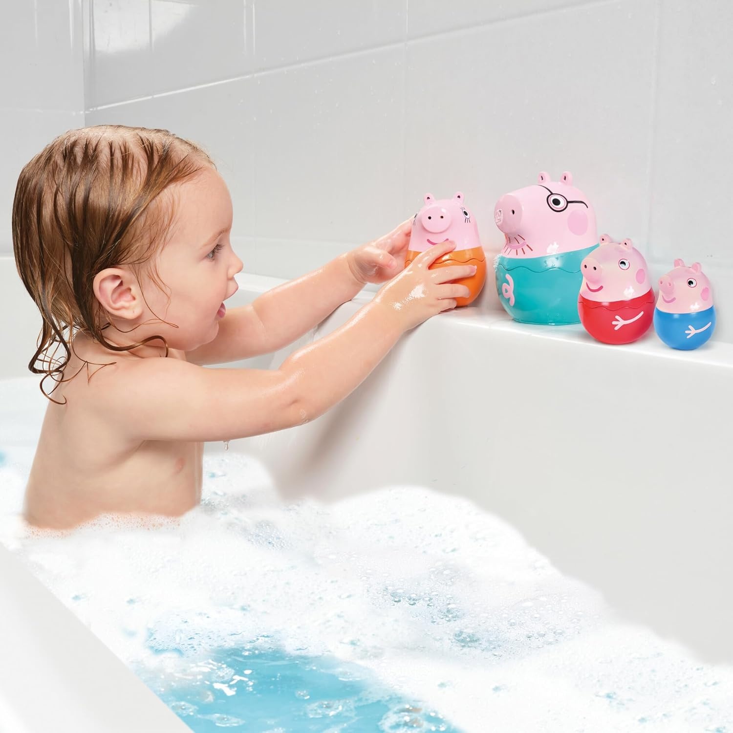 image:imageTOMY Toomies Grow with Peppa Pig  Peppas Activity House  Kids Activity Center with Sensory Shape Sorting and Color Matching Games  Includes 4 Peppa Pig Family Textured Blocks  18 Months and UpPeppas Nesting Family